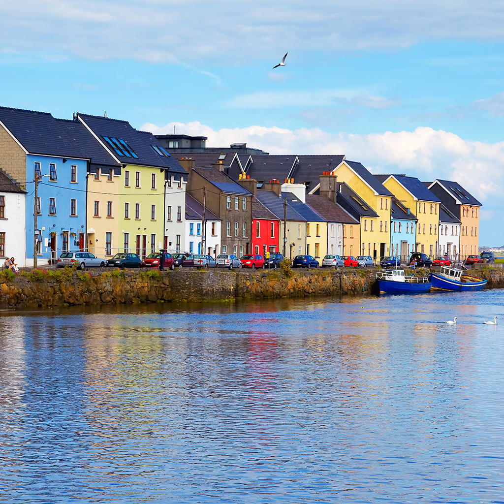 The Claddagh Galway in Galway Ireland is a row of colorful houses next to the water